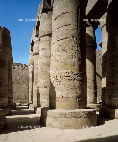 AIS-F-016556-0000 - Great Temple of Amon-Re. 16th-4th c. BC. EGYPT. Karnak. Thebes. Temple of Amon - Ra. Hypostyle Hall. Columns decorated with reliefs carried out in times of Seti I and Ramses II. Egyptian art. New Kingdom. Architecture. - Vannini / Iberfoto/Archivi Alinari