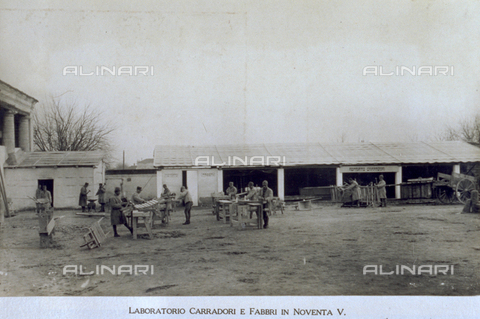 AVQ-A-000006-0011 - The open area in front of the wheelwright and blacksmith sectors of the 9° Machinegun Division in Noventa Vicentina. A number of soldiers are busy doing carpentry work - Date of photography: 1918-1919 - Alinari Archives, Florence