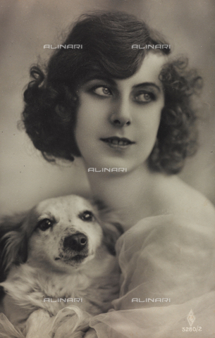 AVQ-A-000047-0072 - Portrait of a young woman with a dog, postcard - Date of photography: 1910-1920 - Alinari Archives, Florence