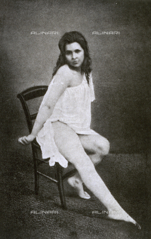 AVQ-A-000200-0031 - Young woman affected by convulsive hysteria. She is seated and showing her limbs with the muscles stiffly contracted - Date of photography: 1878 - Verchi Marialieta Collection / Alinari Archives, Florence