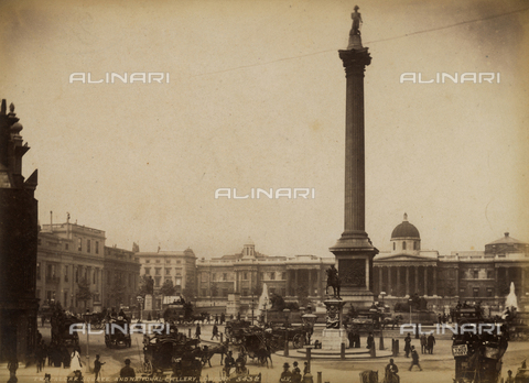 AVQ-A-000223-0027 - Trafalgar Square in London, with numerous carriages and pedestrians passing by. At the center of the square is the famous monument to Nelson with the statue of the Admiral on top. In the background the National Gallery - Date of photography: 1860-1880 ca. - Alinari Archives, Florence