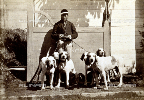 AVQ-A-000477-0001 - Full-length portrait of a man. He is on a sidewalk and has six hunting dogs of the same breed on a leash - Date of photography: 1865 - Alinari Archives, Florence