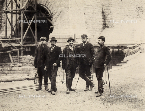 AVQ-A-001321-0031 - Construction of Worcheiner Tunnels, begun in 1897. The tunnel connected the general plan to Trieste. The image shows a group of inspectors at the entrance of the tunnel. The album was commissioned by the Friulian entrepreneur Giacomo Ceconi from Montececon - Date of photography: 1905 ca. - Alinari Archives, Florence
