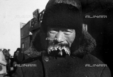 AVQ-A-001479-0086 - Half-length portrait of an elderly Russian of Mongolian ethnic group taken by an Italian soldier in the offensive campaign of 1942-43. The man's long moustache is iced over by the below freezing temperatures - Date of photography: 02-03/1943 - Alinari Archives, Florence