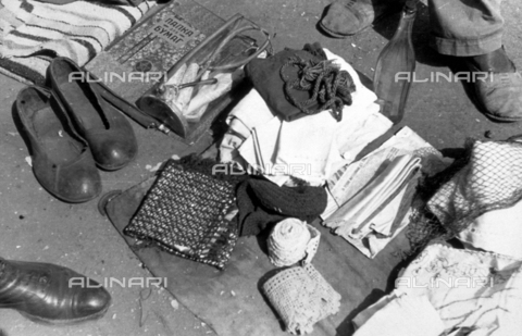 AVQ-A-001479-0122 - Old clothing accessories and various objects sold in a flea market in Gomel - Date of photography: 01-03/1943 - Alinari Archives, Florence