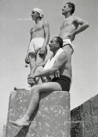 AVQ-A-001479-0129 - Full-lenth portrait of three young men in bathing suits on the pier of Cattolica (Italy) - Date of photography: 04/1943 - Alinari Archives, Florence