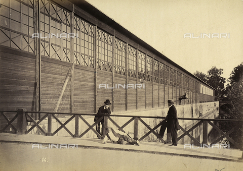 AVQ-A-001591-0003 - National Italian Exposition of 1861: view of the warehouse with the machines Three men are shown near a wooden balustrade - Date of photography: 1861 - Alinari Archives, Florence