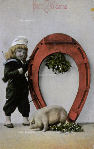AVQ-A-002062-0092 - New Year's greeting card. A small girl dressed as a chimney-sweep is posing in the studio next to a large horse-shoe. In the foreground, a small pig has been drawn in - Date of photography: 1910-1920 ca. - Alinari Archives, Florence