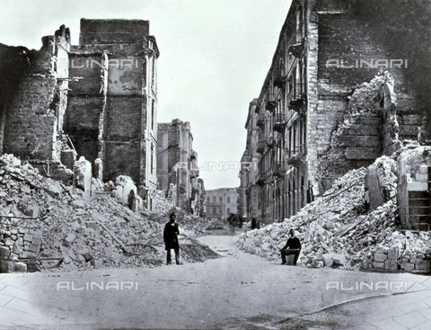 AVQ-A-002695-0022 - Sesostrai Street, in old Alexandria, Egypt, seriously damaged by the shelling of 1882. In the foreground two men are posing near the rubble of a few buildings - Date of photography: 1882 - Alinari Archives, Florence