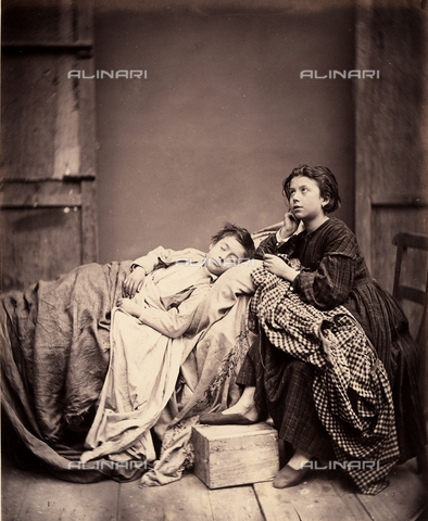 AVQ-A-003142-0010 - "L'ammalato". Genre scene set in a hovel with a sick child in a bed, lovingly taken care of by his young sister - Date of photography: 1870-1880 ca. - Alinari Archives, Florence