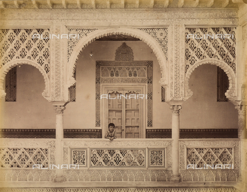 AVQ-A-003897-0006 - The upper part of the patio of las Muà±ecas in the Alcazar, Seville. The patio, dating back to the Caliphs of Cordoba, is an example of Mudéjar decoration with azulejos (colored tiles) and stucco Arabesques - Date of photography: 1880 - 1890 - Alinari Archives, Florence