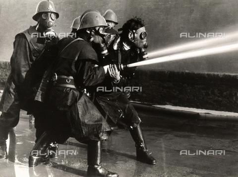 BBA-F-004648-0000 - Some firemen at work with gas-masks and fire-plugs. - Date of photography: 1950-1960 - Alinari Archives, Florence