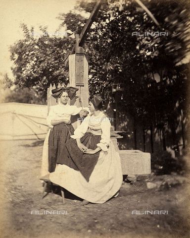 FCC-F-015268-0000 - Two Alsatian women pose in traditional costume, near a water pump - Date of photography: 1866 - Alinari Archives, Florence