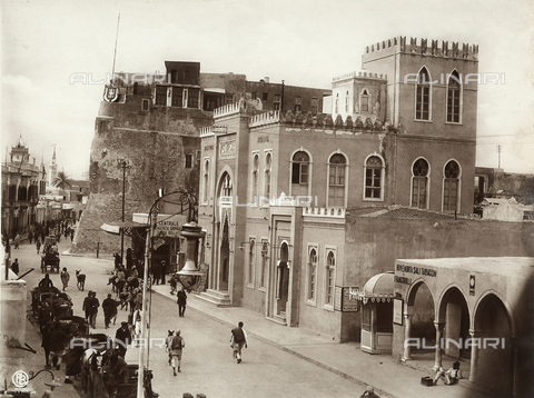 GLQ-F-002496-0000 - A view of a street in Tripoli, with a few buildings in Arab style and a fortress. The image dates back to the Italian conquest of Libya, just after the Italian - Turkish war of 1911-1912 - Date of photography: 1911-1912 - Alinari Archives, Florence
