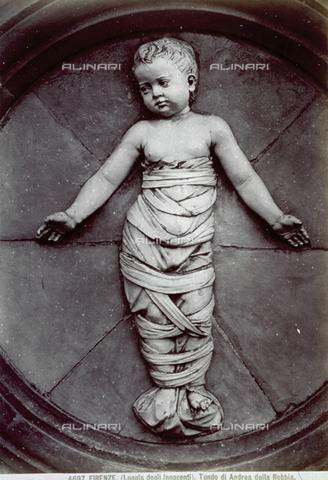 MFC-A-004682-0047 - One of the eight glazed terra cotta roundels in the Portico of the Ospedale degli Innocenti in Florence. In the roundel is an infant in swaddling clothes, by Andrea della Robbia (1463) - Date of photography: 1880-1890 ca. - Alinari Archives, Florence
