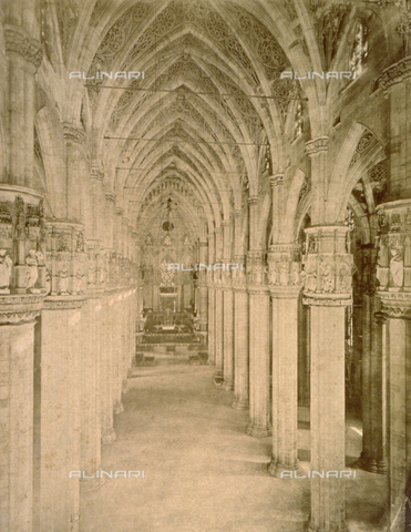 MFC-F-000848-0000 - The nave of the Cathedral of Milan. The vaulting springs from fifty-fwo polystyle piers, crowned by monumental capitals with niches containing statues of saints. The ribbed vaults are painted with openwork decoration - Date of photography: 1880-1890 ca. - Alinari Archives, Florence