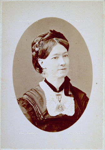 MFC-F-001902-0000 - Half-length portrait of a woman wearing a rich bodice and a small medal around her neck and with a clasp in her hair - Date of photography: 1871-1875 ca. - Alinari Archives, Florence