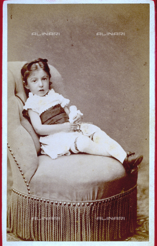MFC-F-001911-0000 - Full-length portrait of a little girl seated on an arm chair - Date of photography: 1860-1880 ca. - Alinari Archives, Florence