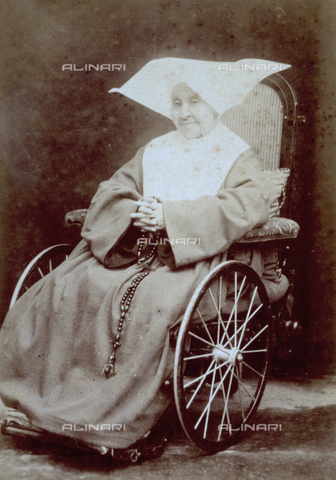 MFC-F-002056-0000 - Full-length portrait of an old nun in a wheel chair - Date of photography: 1890-1900 ca. - Alinari Archives, Florence