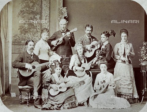 MFC-F-002072-0000 - Portrait of a group of musicians in late nineteenth century dress. The three men and six women are shown playing their instruments - Date of photography: 1870-1880 ca. - Alinari Archives, Florence