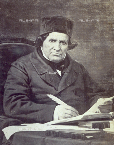 MFC-F-002081-0000 - Portrait of Giovan Battista Niccolini, well known nineteenth century playwright. He is shown half-length, seated at a desk writing - Date of photography: 1861 - Alinari Archives, Florence