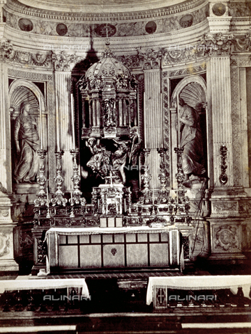 MFC-F-002167-0000 - Chapel of the Sacrament, in the Cathedral of Pisa. There are six large candelabra and a ciborium in silver and bronze on the altar. In the background the statues of Saint Cristina and Saint Mary Magdalene - Date of photography: 1870 ca. - Alinari Archives, Florence