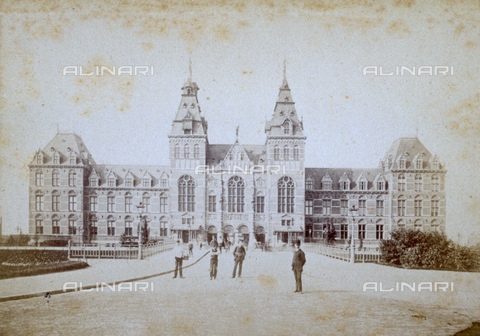 MFC-S-002191-0002 - Frontal of the National Museum in Amsterdam with people in the avenue in front - Date of photography: 1865-1875 ca. - Alinari Archives, Florence