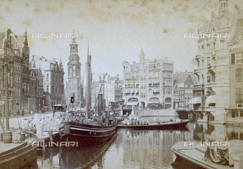 MFC-S-002191-0006 - A canal in Amsterdam with boats used for transporting merchandise drawn up. Boxes and barrels can be seen on the pier - Date of photography: 1865-1875 ca. - Alinari Archives, Florence