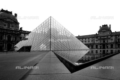MGA-F-000219-0000 - Cour Napoleon of the Palais du Louvre with one of the glass and metal pyramids made by Leoh Ming Pei, Paris - Maurizio Gabbana Archive/ Alinari Archives