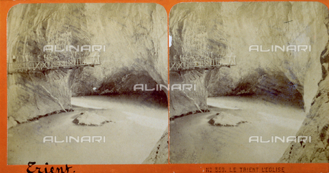 PDC-F-000431-0000 - The Trient river flows between high rocky walls. To the right a grotto; to the left, on the rocks, a wooden footbridge runs along the course of the river below - Date of photography: 05/1871 - Alinari Archives, Florence