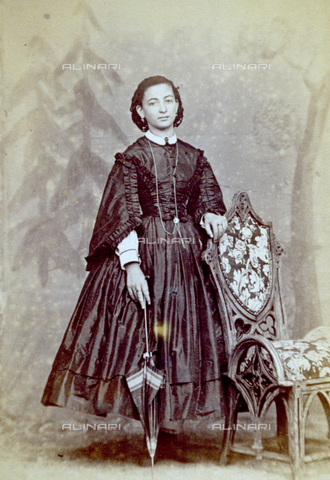 PDC-F-001509-0000 - Portrait of a young woman in elegant day dress with a small parasol - Date of photography: 1860 -1870 ca. - Alinari Archives, Florence