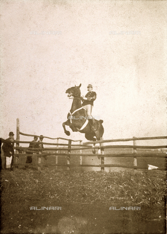 PDC-F-001778-0000 - Portrait of a soldier in uniform taken just as his horse jumps an obstacle - Date of photography: 1880-1900 ca. - Alinari Archives, Florence