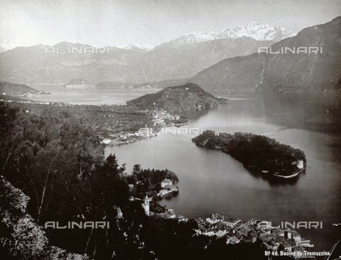 PDC-F-001933-0000 - View of Tremezzina, a health resort in the central basin of Lake Como. At the center of the basin is a small island with dense vegetation. In the background, snow-covered mountains - Date of photography: 1870-1890 ca. - Alinari Archives, Florence