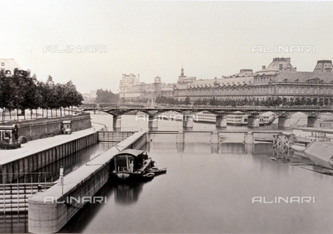 PDC-S-000252-0008 - Partial view of part of paris: in the foreground, the seine with a few ships tied up and the embankment. In the background a bridge and a few buildings - Date of photography: 1855-1865 - Alinari Archives, Florence