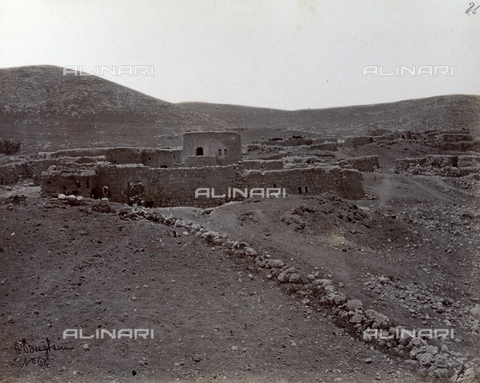 PDC-S-000275-0001 - The stone structures of a settlement in Nain, along the ridge of a barren landscape of bare earth and stones. - Date of photography: 1860-1870 ca. - Alinari Archives, Florence