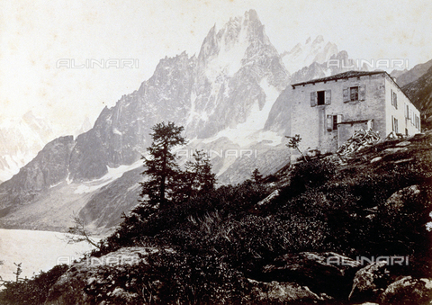 PDC-S-000459-0001 - Mountain landscape: field and house in the foreground, high mountain peaks in the background - Date of photography: 1860 - 1880 ca. - Alinari Archives, Florence