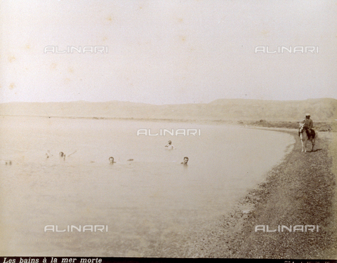 PDC-S-000752-0013 - Group of men bathing in the waters of the Dead Sea. A man on horseback at the water's edge, in traditional clothes - Date of photography: 1880-1900 - Alinari Archives, Florence